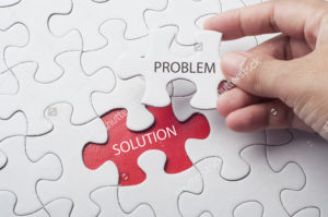 stock-photo-hand-holding-piece-of-jigsaw-puzzle-with-word-problem-solution-548561134